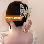 Pinza con forma de mariposa con perlas